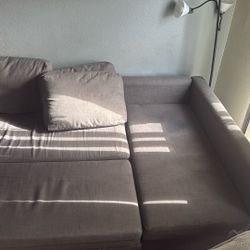 Gray Couch With Storage + Longer Piece Slides In If Not Used. 