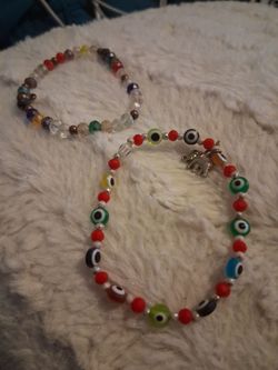 Set of colorable bracelets , one carrying a elephant charm