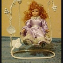 ANTIQUE DOLL MADE ON A SWING