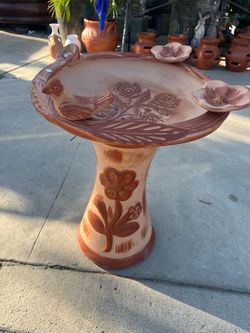 Clay bird bath