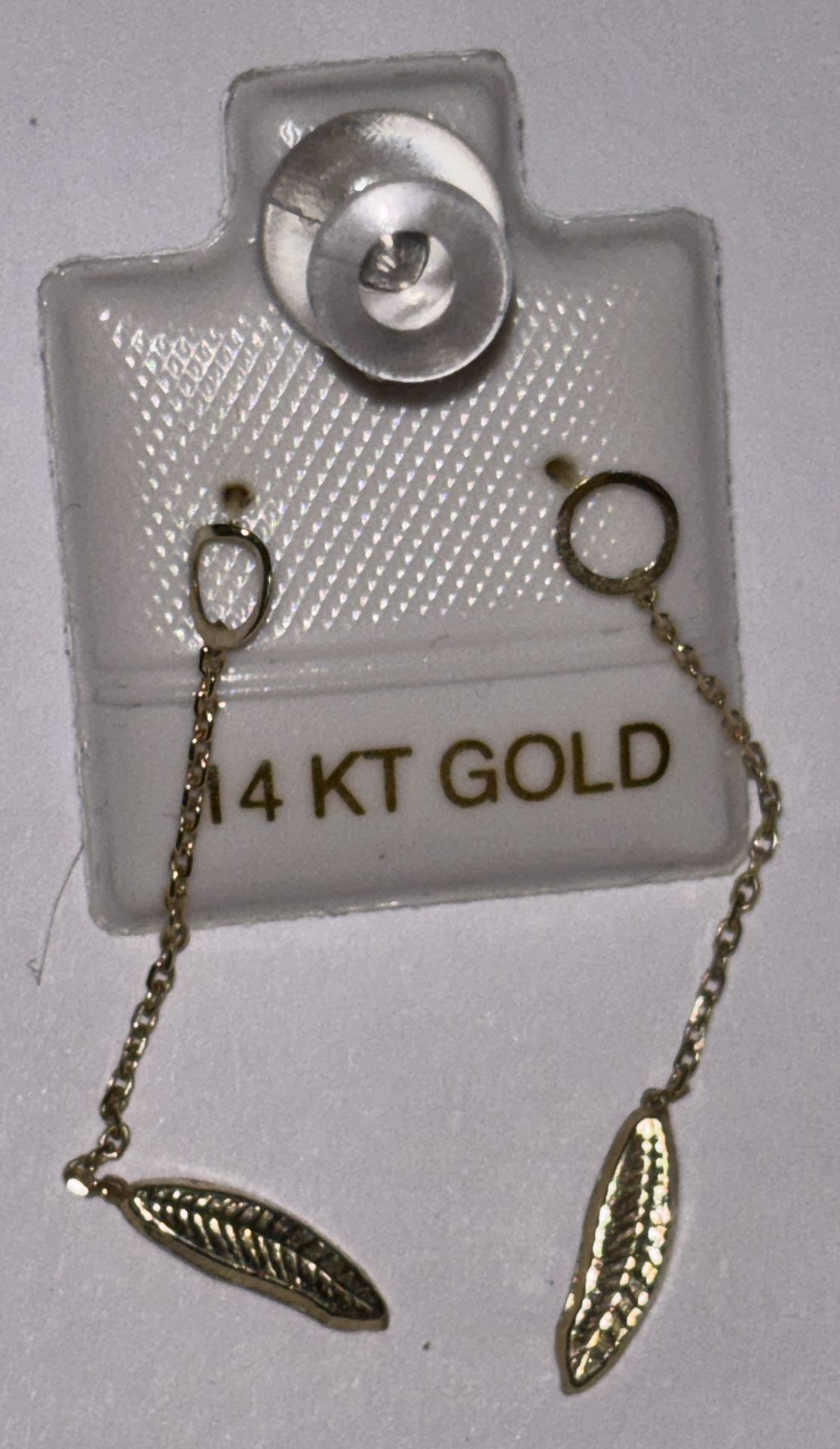 14 karat yellow gold chain-link earrings with leaf-shaped pendants.