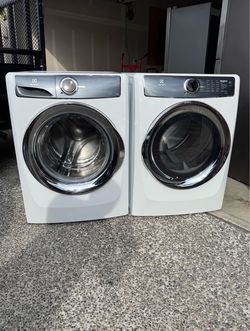 Electrolux 4.4 Cu.Ft Front-Load washer and 8.0  Cu.Ft electric dryer. H-38” W-27” D-32”.