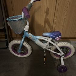 Girls frozen bike with training wheels and front basket