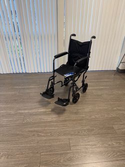 $65 / New - Drive medical transport wheelchair / 250 pound capacity / folds compact