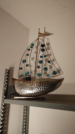 Large metal and glass sail boat
