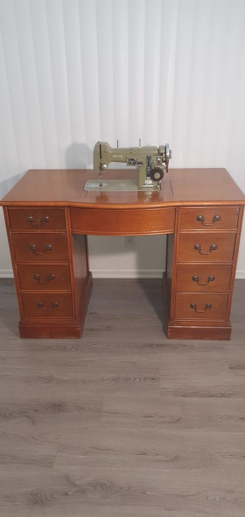 Sewing machine with a desk.