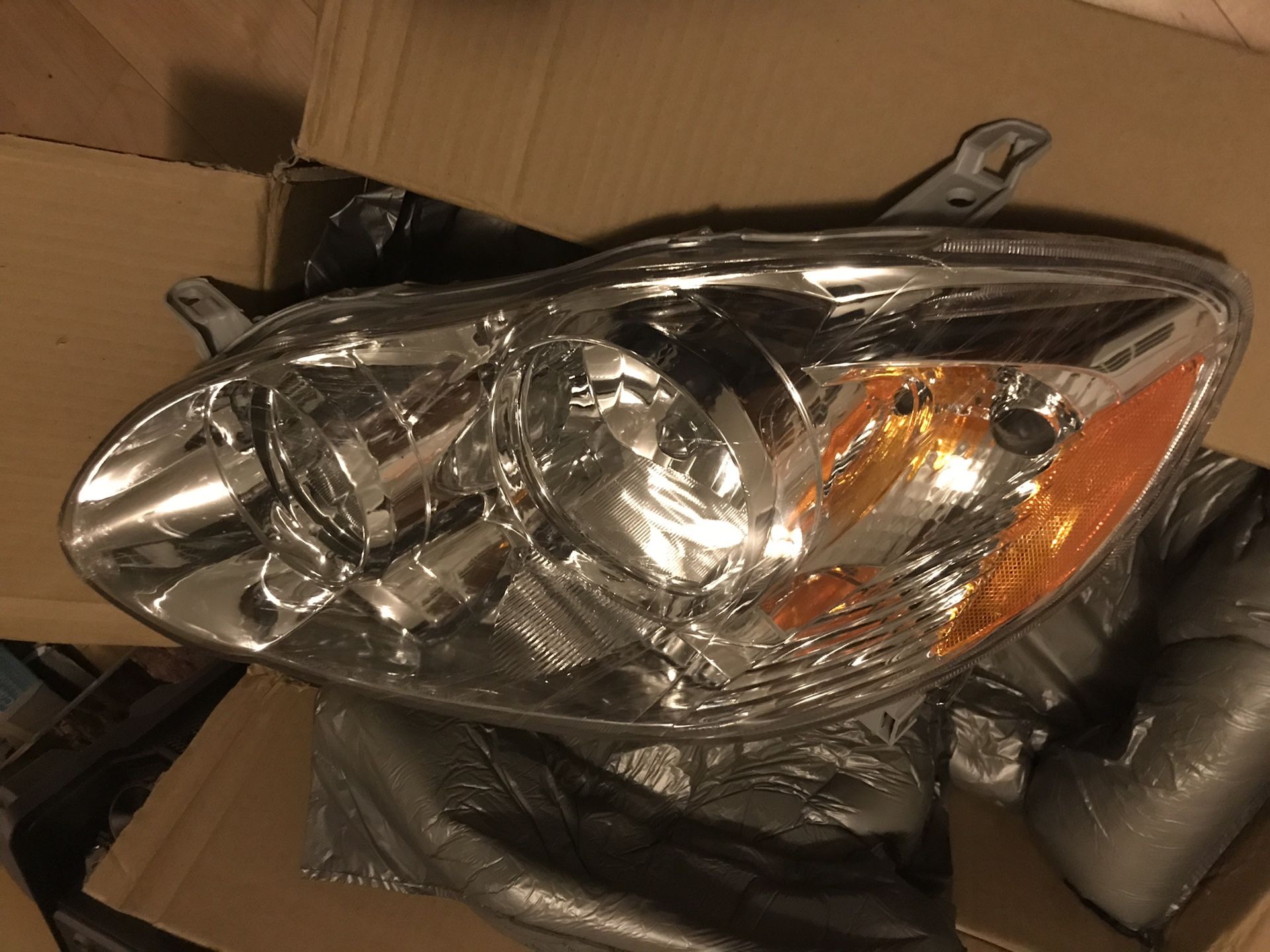 Headlights for Toyota Corolla 2005 through 2008 brand new still in the box, eagle eyes