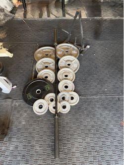 Olympic weights 255lbs total plus 7ft 45lbs bar and weights tree