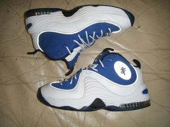 These are Nike Air Penny 2 sneakers in the Atlantic Blue colorway.