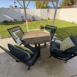 Four Metal Patio Dining Chairs with cushions and pillows