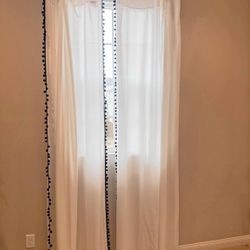 White curtains with black pom pom border   2 panels   Only used for staging in model home