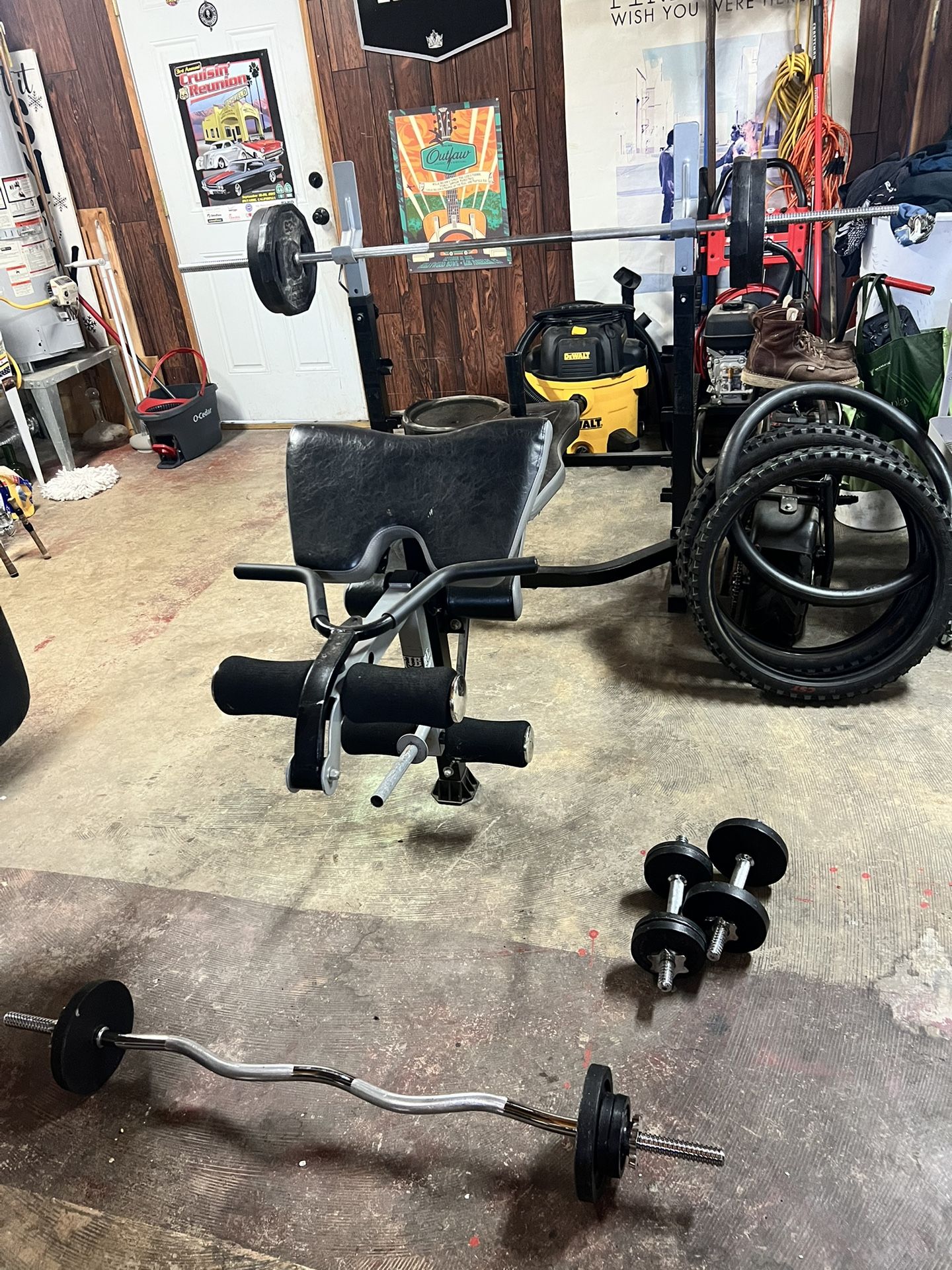 Adjustable Weight Bench W/ 135 Lbs Of Weight. Also A 7 Ft Olympic Bar 