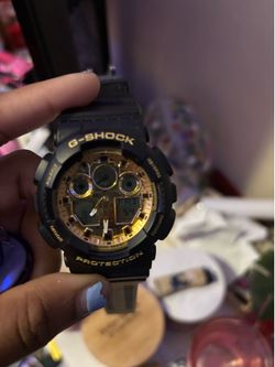 Black and gold G-Shock watxh