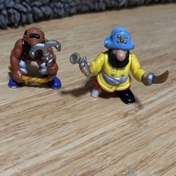 These are vintage Fisher-Price Great Adventures pirate figures from the mid-1990s,