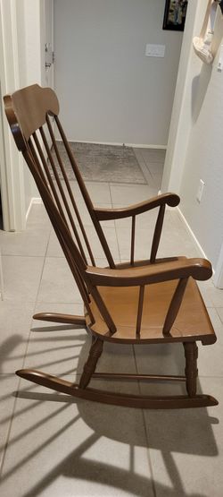 Brown wooden rocking chair
