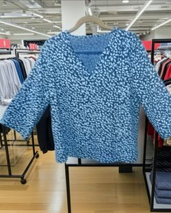 New, never worn stunning size large royal blue and white pattern top with three quarter inch sleeves