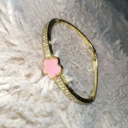 gold and pink bracelet 