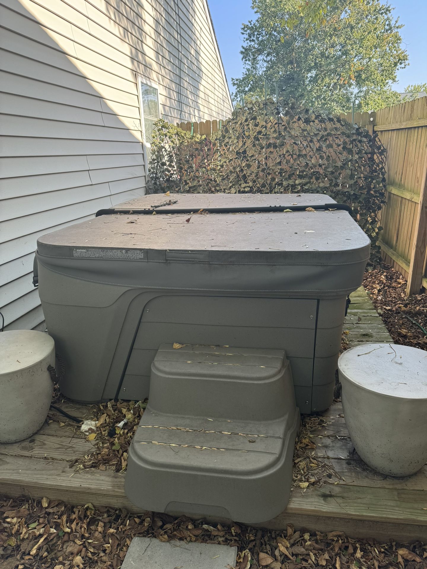 Hot tub with cover and step