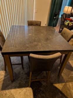 Nice tall dining table with 6 chairs