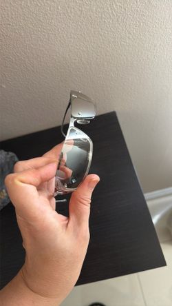 Sunglass rectangular, rimless silver metal frame and mirrored, $17