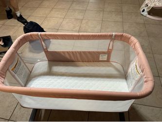 Pink baby bassinet