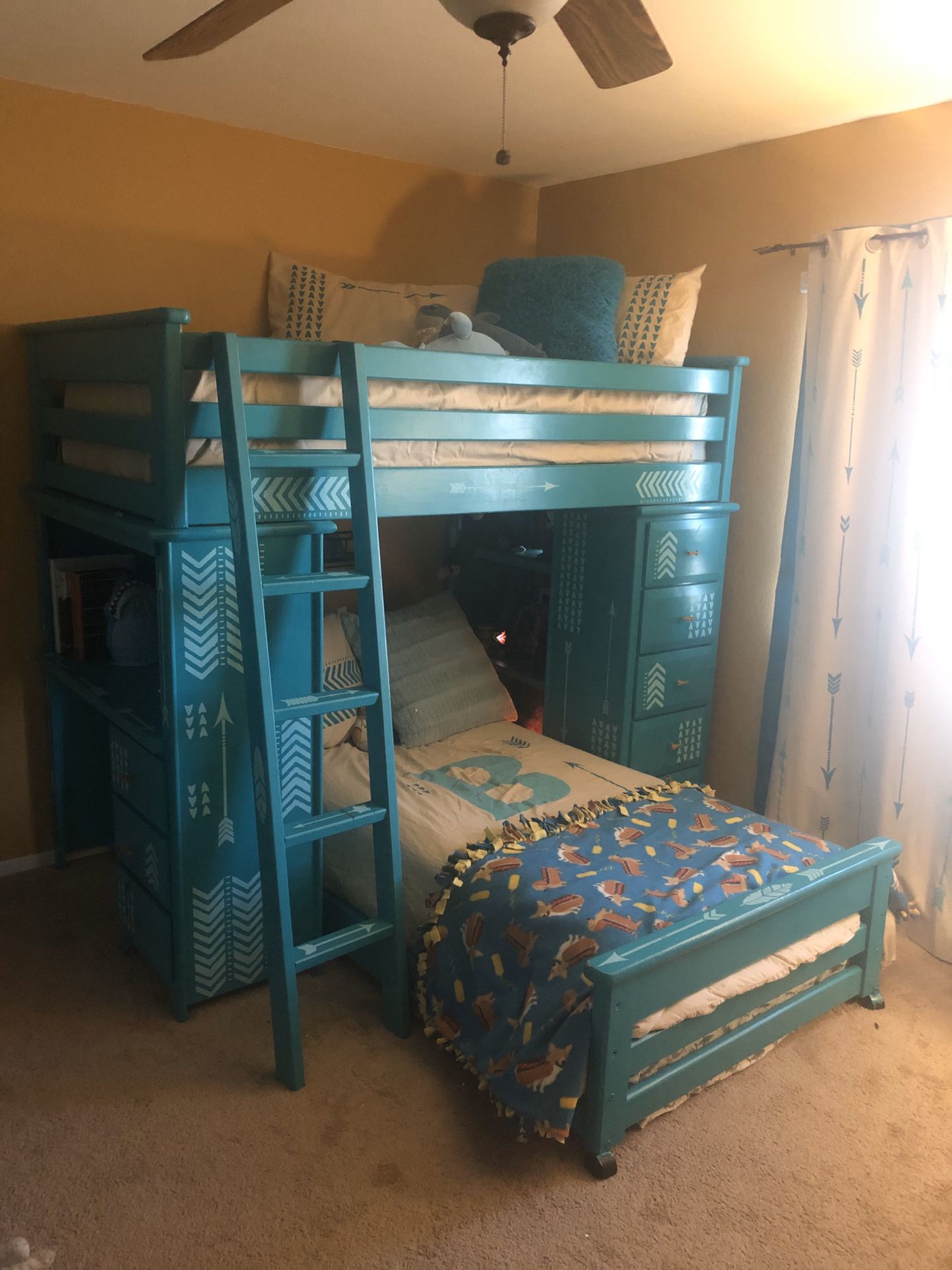 Beautiful hand painted bunk beds with decor!
