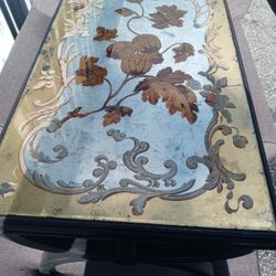 Baker Furniture Hollywood Regency Ebonized and Gold Gilt Cocktail Table With Reverse Painted Mirrored Glass Top

