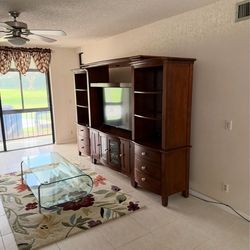Couch like new wall unit like new end tables like new with lamps