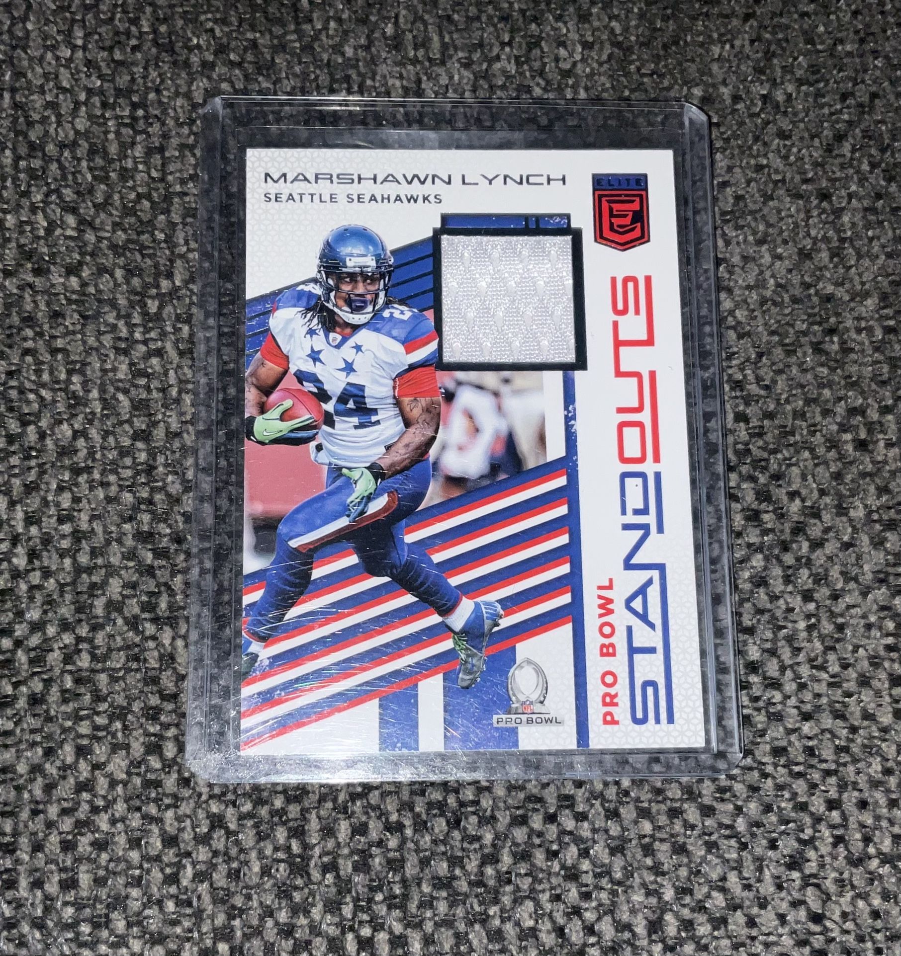2017 Elite Marshawn Lynch Pro Bowl Standouts Elite Material Jersey Card Mint Condition Beast Mode
