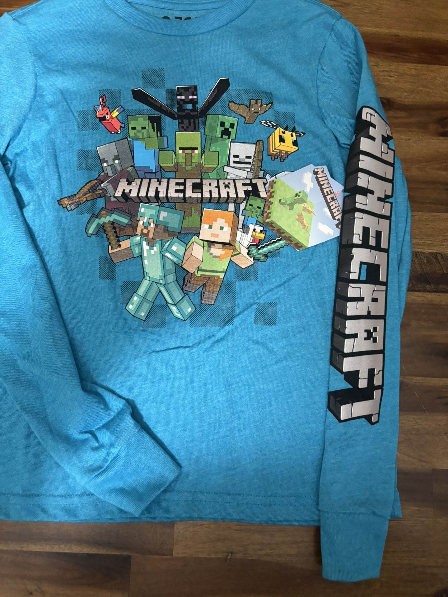 long-sleeve Minecraft t-shirt featuring various characters and a blocky logo