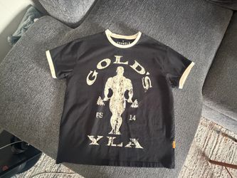 YLA GOLDS GYM RINGER TEE SIZE MEDIUM WITH STAIN ON   COLLAR