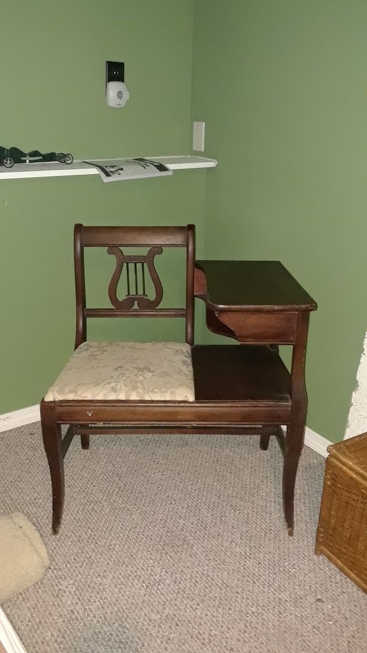 Antique telephone table with seat.