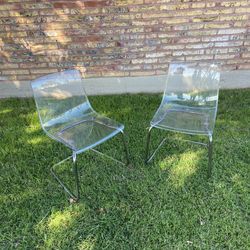 Two vintage acrylic chairs