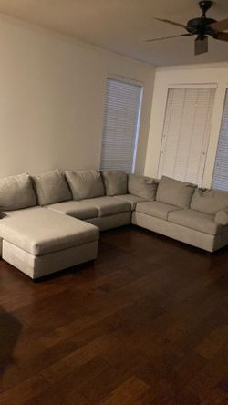 Gray Sectional and Bissell Carpet Cleaner