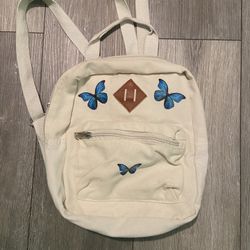 Cream mini backpack with blue butterfly details #cottagecore #festival