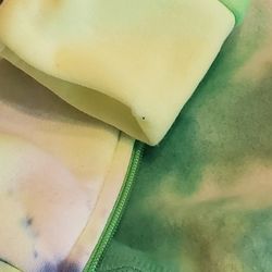 1 new florescent  jacket and 1  black crop sweatshirt 15 dollars