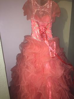 I am selling a coral Quinceanera dress for $600 obo! Any questions please contact me