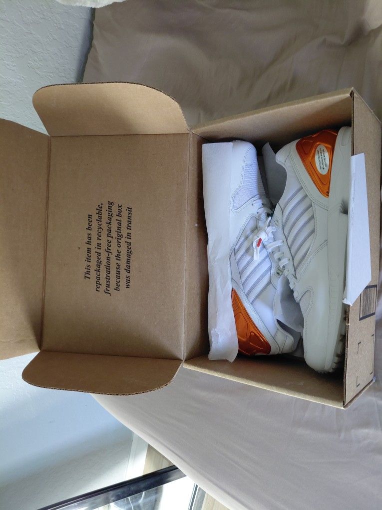 This is an Adidas ZX 5000 "The U" in the Cloud White, Core Orange, and Dark Green colorway.