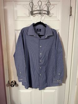 Men’s Size XL Long Sleeve Button down dress shirt.  Made of 50 % Cotton and 50% Polyester.  Brand Dockers.  Preowned Excellent Condition.  Smoke free 
