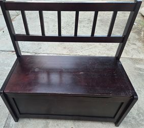 Bench with storage compartment