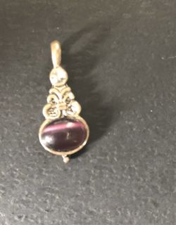 Silver tone pendant