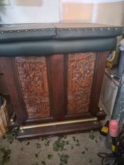 Wood Hand carved asian bar with caster wheels. No damage!