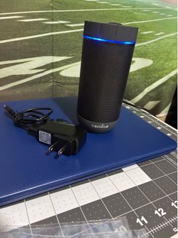Comiso X26 Bluetooth Speaker Featuring A Cylindrical Design With A Grey Top And Base.