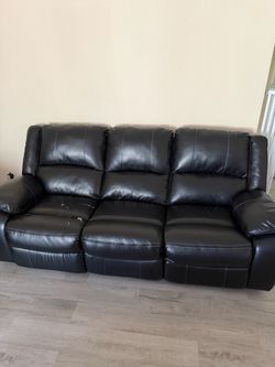Black Faux Leather power Reclining Sofa and loveseat