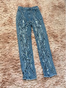 Distressed fringe denim straight leg jeans