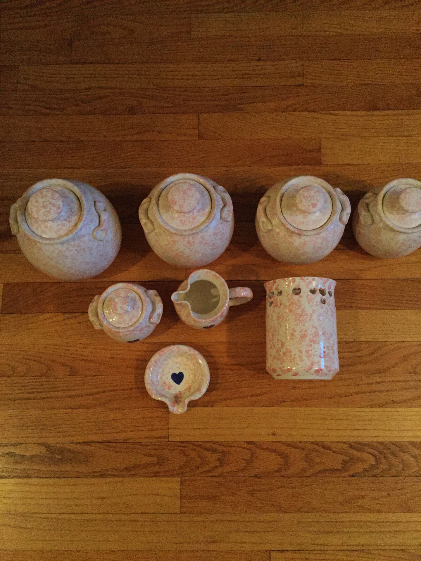 8 piece pink pottery set signed, heavy, well made