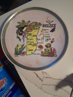 Decorative souvenir plate featuring a colorful illustrated map of Belize, including Belize City, San Pedro, Ambergris Caye, Caye Caulker, Turneffe Isl