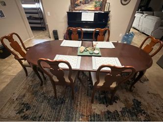 Large wooden table with 6 seats