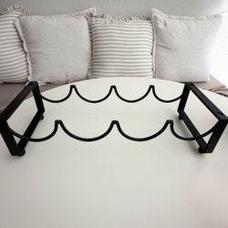 Black metal wavy wine rack