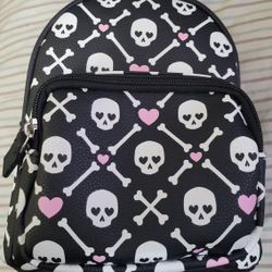 CLAIRE'S SKULLS/CROSS BONES PINK HEART MINI BACKPACK FOR $20